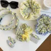 The new 2026 yellow and green checkered large intestine hair band exudes a sweet and elegant charm. It features a hair tie with elastic bands and a checkered hair tie Application Scenario